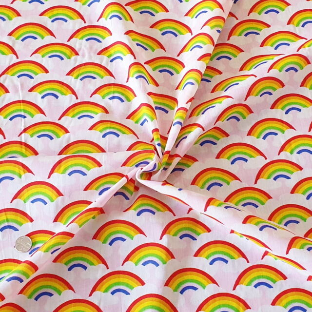 1 Metre Rainbows and Clouds Polycotton Fabric Pink Background x 43"
